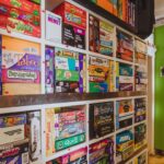 A shelf filled with Board Games in Le Moque-Tortue's main dining room.
